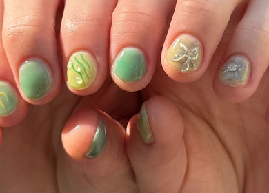 Close-up of vibrant green nail art at MueseoYu Nail, Vancouver, British Columbia, CA.