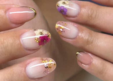 Elegant floral nail art at MG Velvet Pro, Brentwood, California, US. Perfectly manicured hands with flower accents.