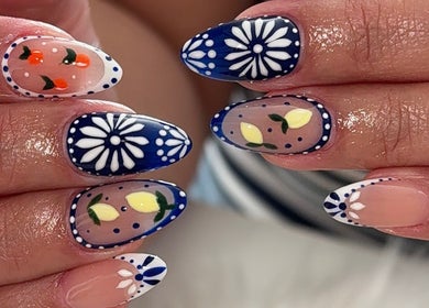 Intricate floral and fruit nail art at MG Velvet Pro, Brentwood, California, US.