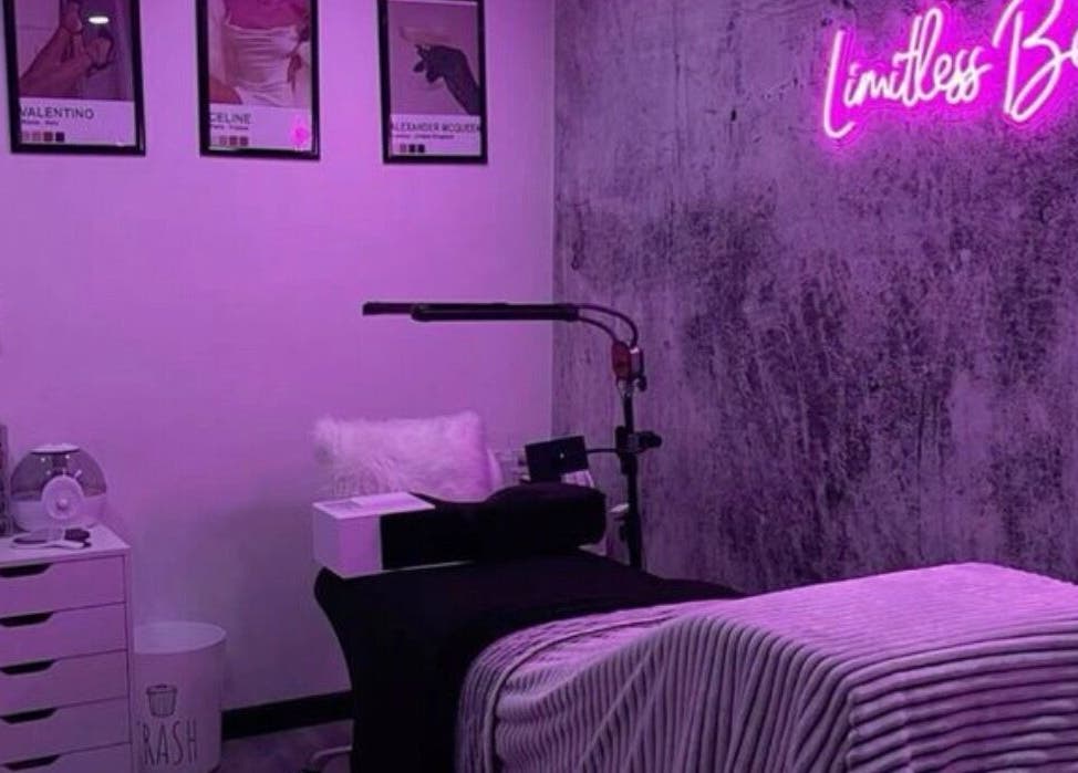 Cozy treatment room at The Nix Edit Beauty Bar in Castries, LC, featuring purple lighting and chic decor.