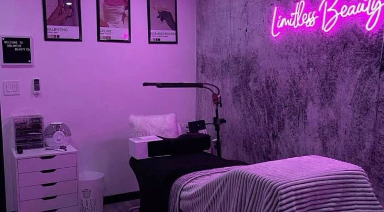 Cozy treatment room at The Nix Edit Beauty Bar in Castries, LC, featuring purple lighting and chic decor.