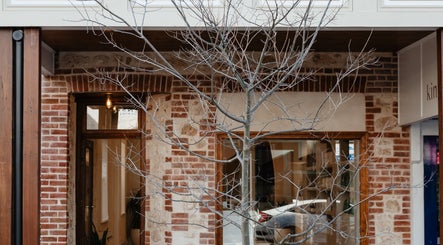 Charming brick facade of Kink in Victor Harbor, South Australia, AU, reflecting a warm, welcoming atmosphere.