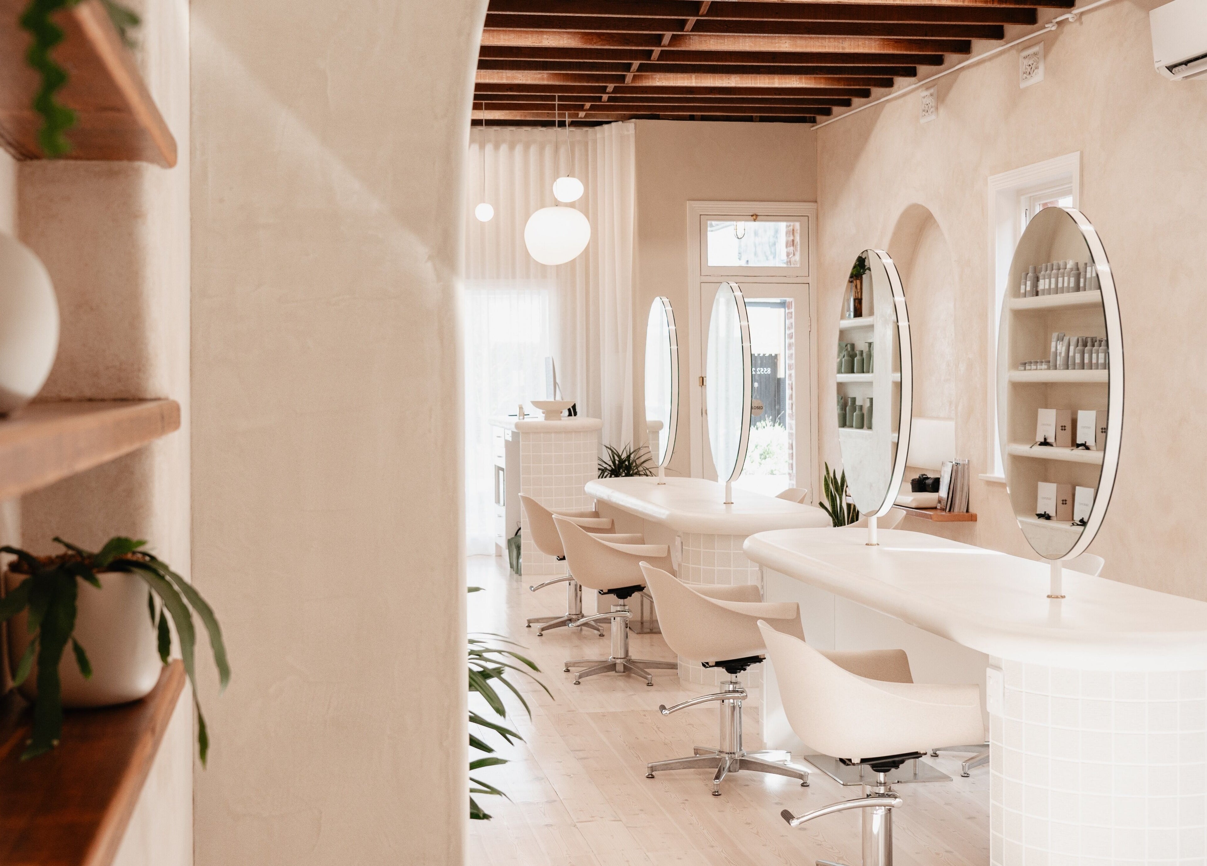 Modern beauty salon at Kink, Victor Harbor, South Australia, AU featuring elegant styling stations.