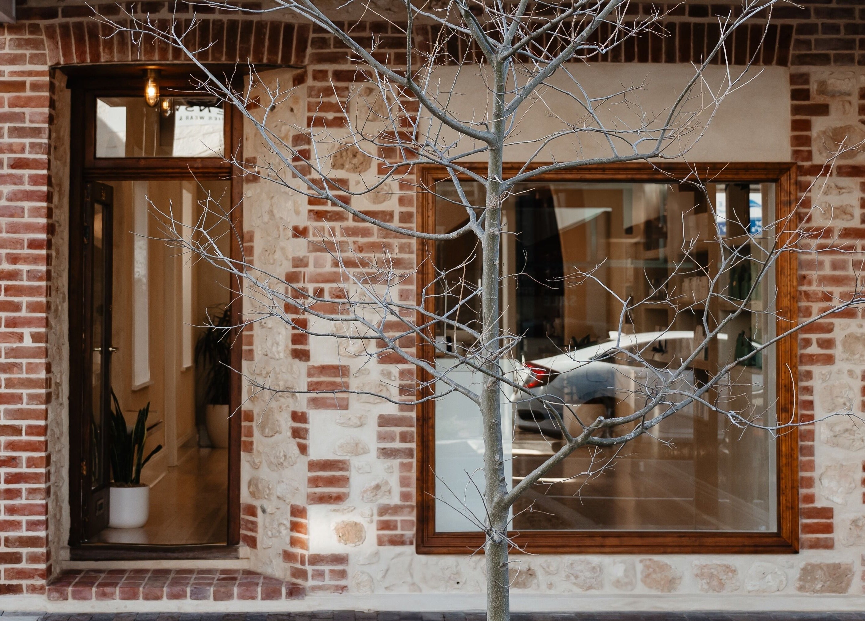 Kink's inviting brick exterior in Victor Harbor, South Australia welcomes beauty lovers with warm rustic charm.