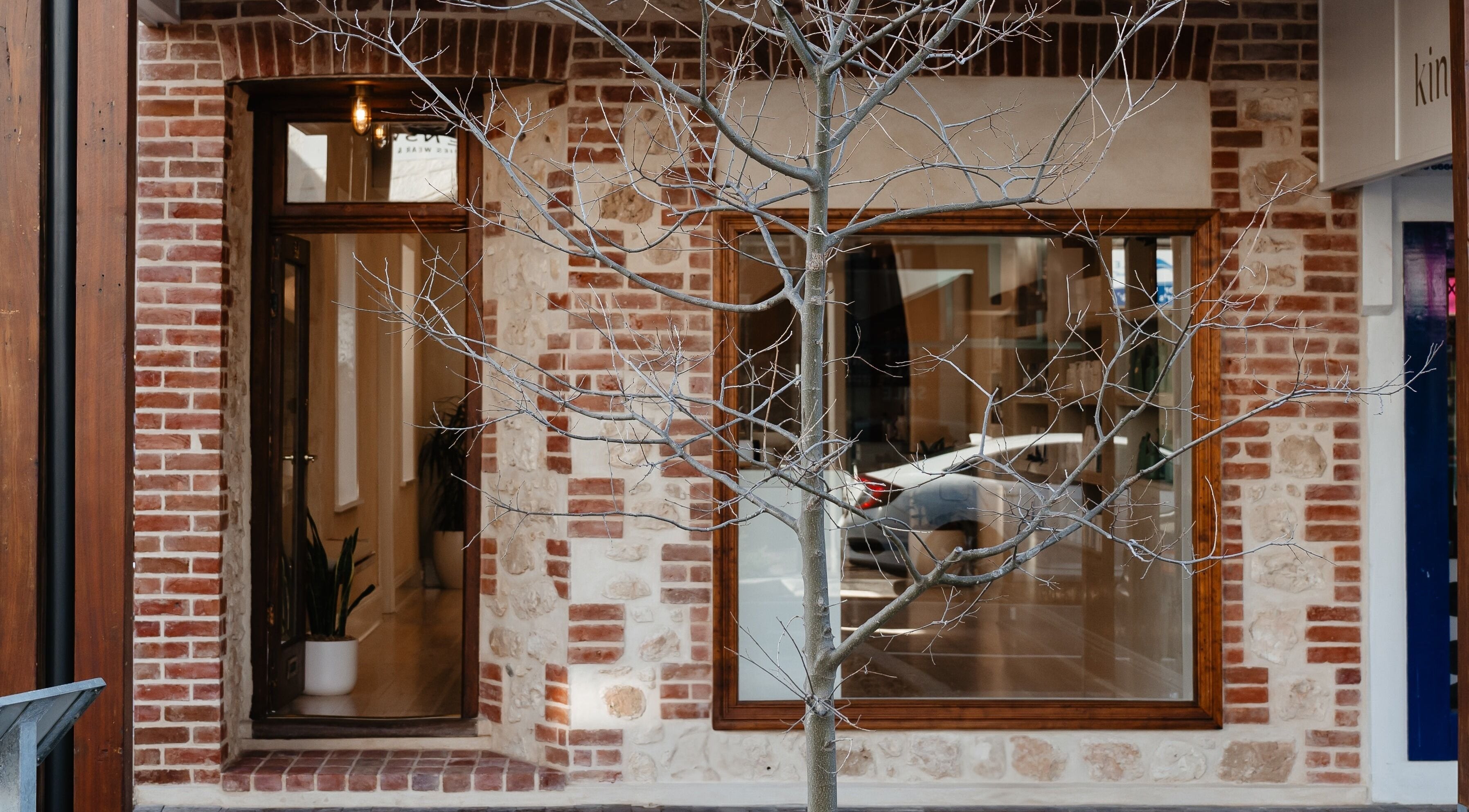 Kink's inviting brick exterior in Victor Harbor, South Australia welcomes beauty lovers with warm rustic charm.