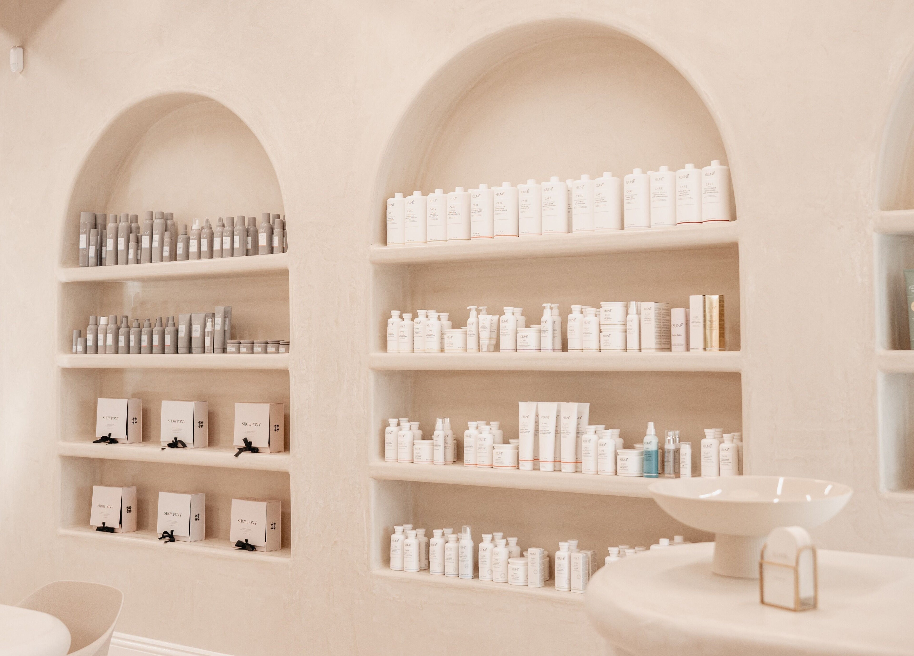 Elegant product shelves at Kink, Victor Harbor, South Australia, showcasing premium beauty collections.