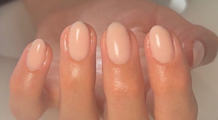 Close-up of freshly manicured nails at Cure in Appleby, NZ. Glossy, natural finish.
