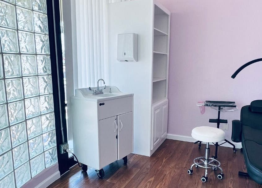 Modern beauty treatment room at Cendelle in San Antonio, Texas, featuring sleek furnishings and a serene atmosphere.