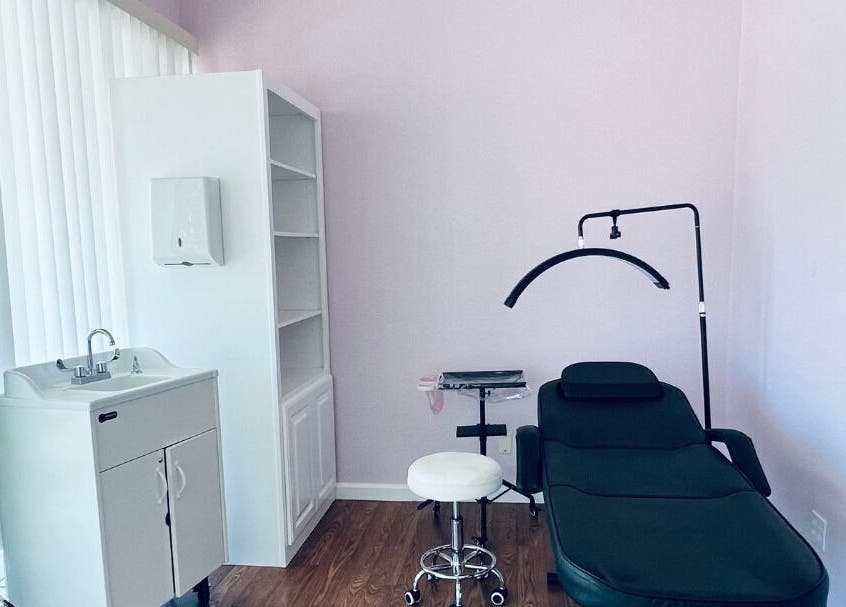 Modern spa room at Cendelle in San Antonio, Texas, US featuring a sleek massage table and bright decor.