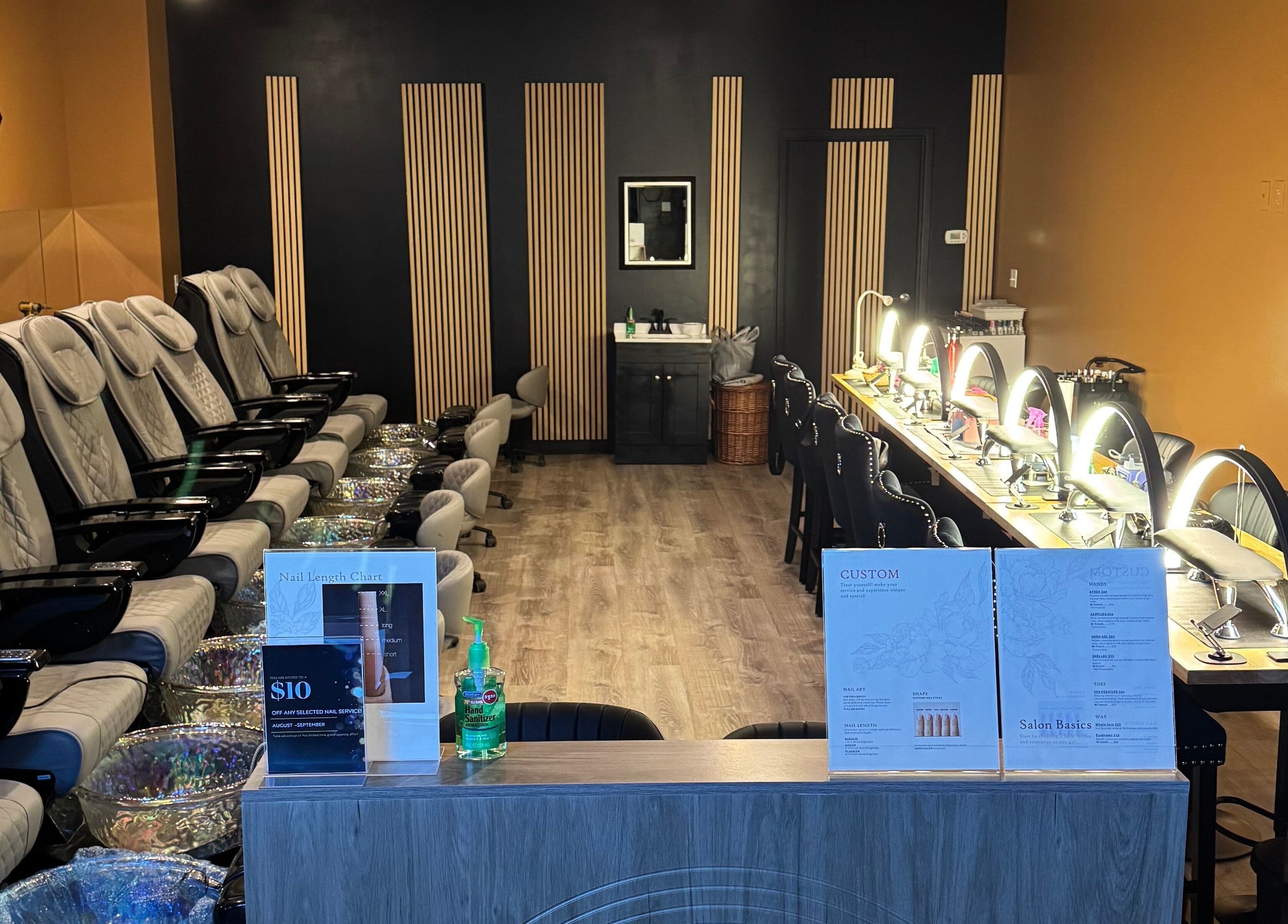 Interior of Lamour Nails in Orem, Utah, US featuring luxury pedicure chairs and manicure stations.