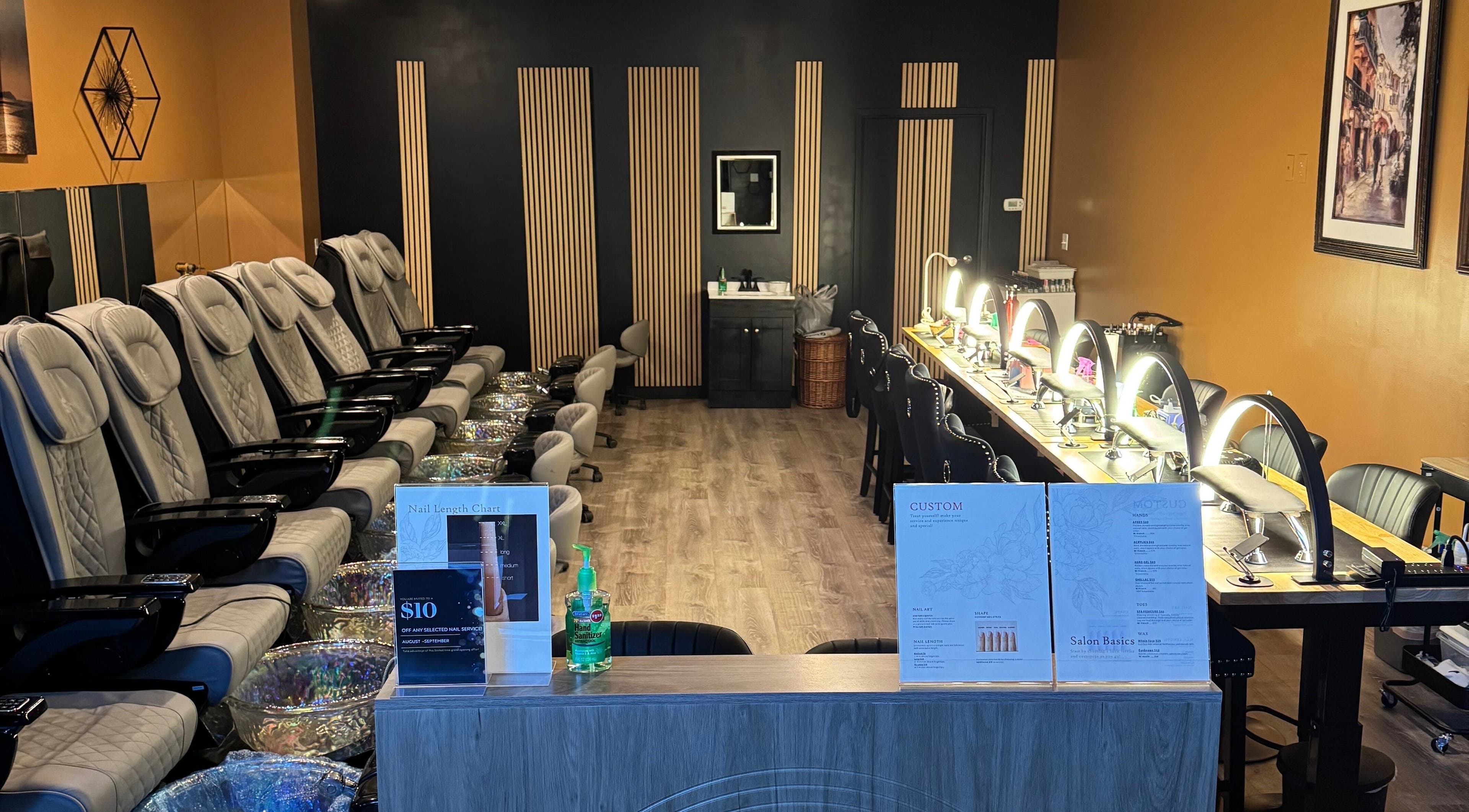 Interior of Lamour Nails in Orem, Utah, US featuring luxury pedicure chairs and manicure stations.