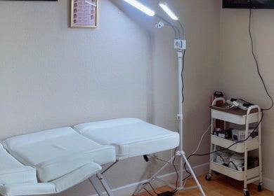 Spa treatment room at TY Beauty in Portadown, Northern Ireland, GB, featuring a comfortable massage bed and lighting.