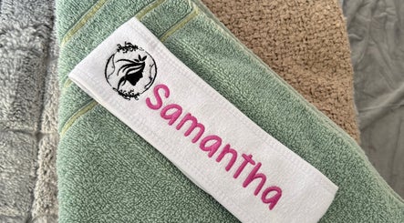Embroidered towels at Samantha’s head spa ltd in Nottingham, England, GB, showcasing spa luxury.