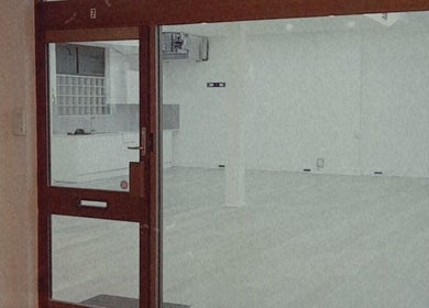 Entrance view of The Black Rabbit skin clinic in Newcastle, New South Wales, AU, showcasing a minimalist interior.