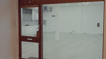 Entrance view of The Black Rabbit skin clinic in Newcastle, New South Wales, AU, showcasing a minimalist interior.
