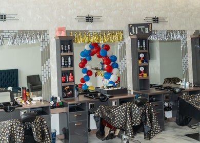 Stylish salon interior at EKI ROYAL BEAUTY LOUNGE, Edmonton, Alberta, CA with decorative mirrors and balloons.