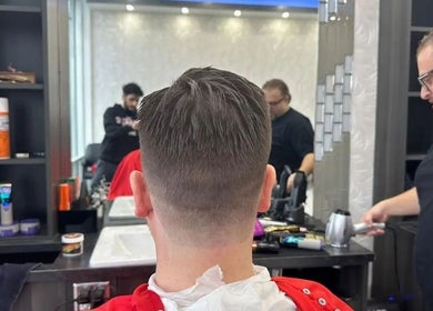 Back view of a haircut at EKI ROYAL BEAUTY LOUNGE, Edmonton, Alberta, CA, showcasing expert grooming.