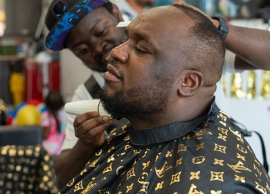 Customer receives a beard trim at EKI ROYAL BEAUTY LOUNGE in Edmonton, Alberta, CA.