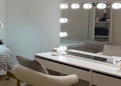 Chic beauty room with vanity and lighting at Belle Beauty, Maud, Scotland, GB.