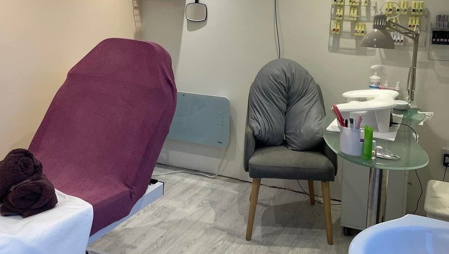 Relaxing treatment room at Orange Blossom Beauty, Park Gate, England, GB with a plush chair and manicure setup.