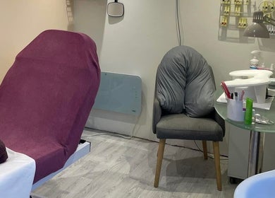 Relaxing treatment room at Orange Blossom Beauty, Park Gate, England, GB with a plush chair and manicure setup.