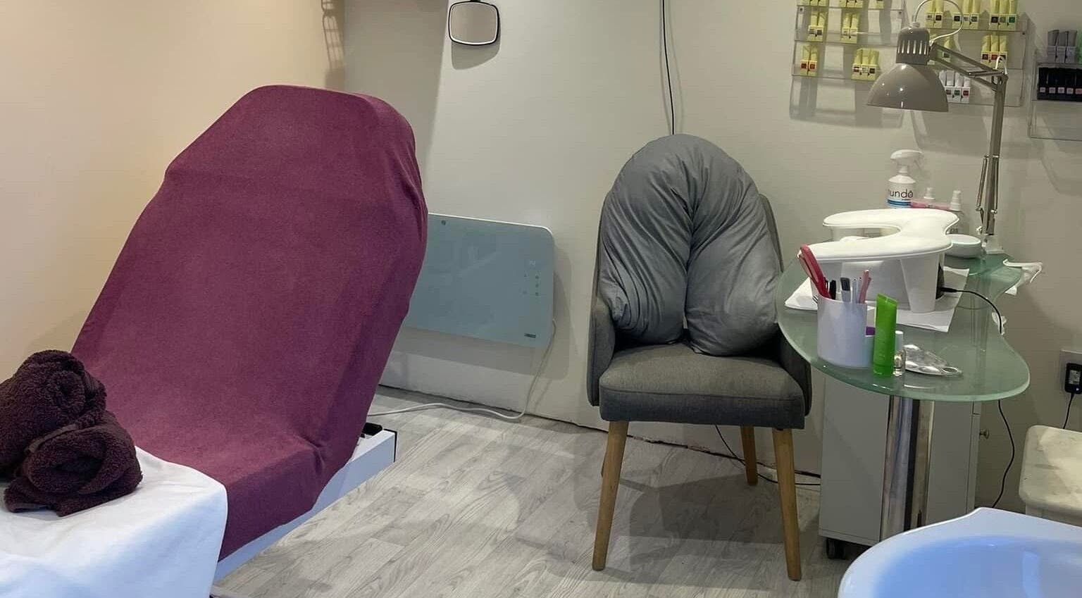 Relaxing treatment room at Orange Blossom Beauty, Park Gate, England, GB with a plush chair and manicure setup.