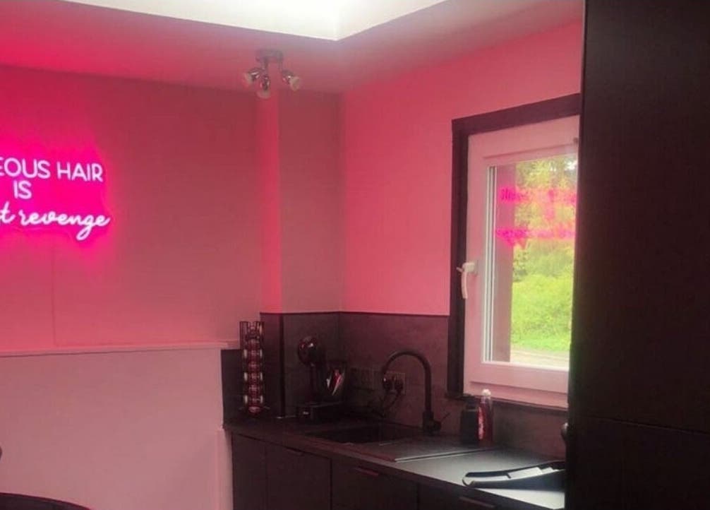 Chic interior with neon sign reading 'Gorgeous Hair' at LashMuse, Tweedbank, Scotland, GB.