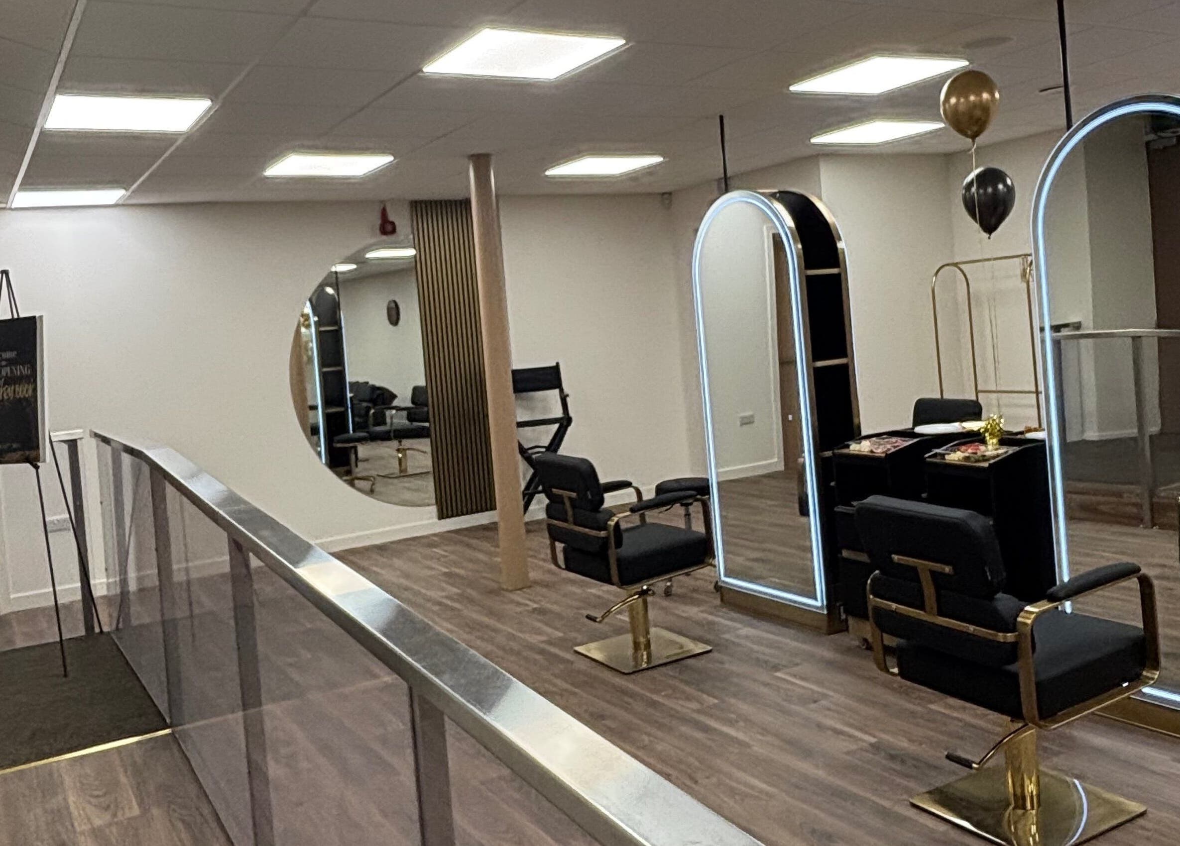 Elegant interior of LashMuse in Galashiels, Scotland, GB featuring modern salon chairs and large illuminated mirrors.