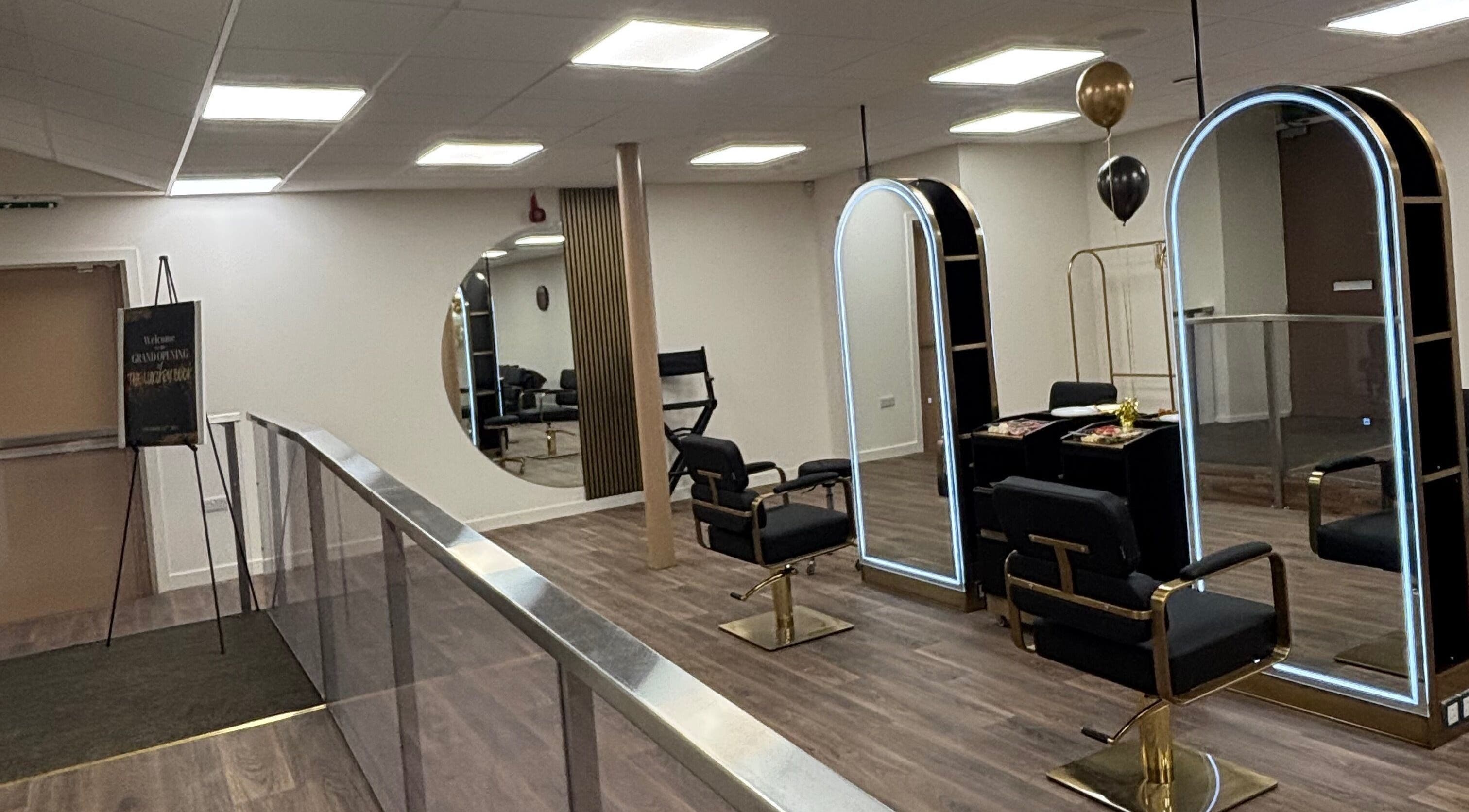 Elegant interior of LashMuse in Galashiels, Scotland, GB featuring modern salon chairs and large illuminated mirrors.