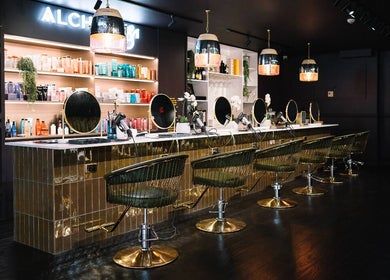 Elegant beauty station at Alchemy & I, Palmerston North, Manawatū-whanganui Region, NZ displaying salon chairs and products.