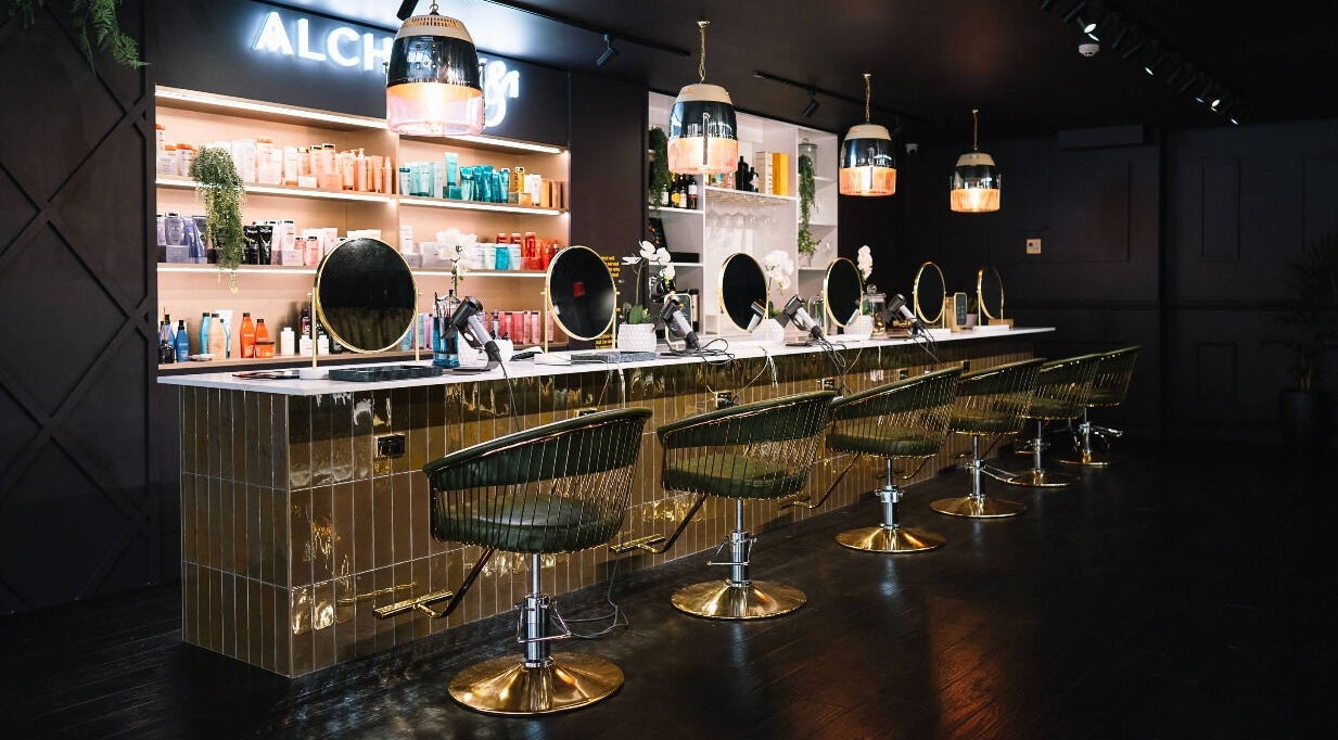 Elegant beauty station at Alchemy & I, Palmerston North, Manawatū-whanganui Region, NZ displaying salon chairs and products.