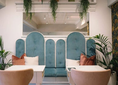 Elegant seating area at Alchemy & I, Palmerston North, Manawatū-whanganui Region, NZ, with plush teal and coral decor.