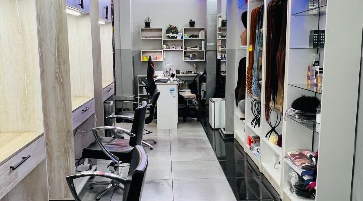 Modern interior of Evolutio Hair Salon, Cape Town, featuring sleek styling stations and hair product displays.