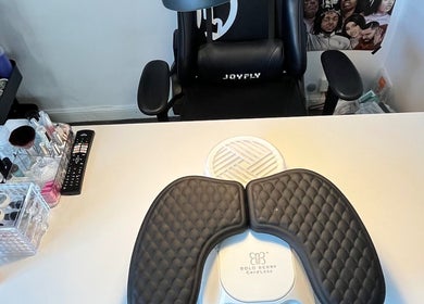 Modern nail station at B.T.Z Nails in Scarborough, England, GB, showcasing organized tools and a comfy chair.
