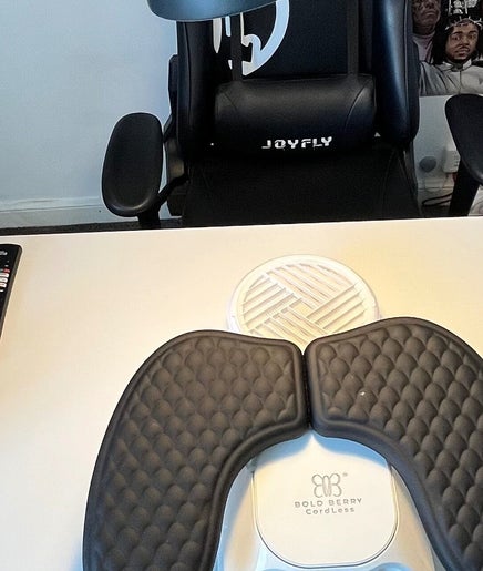 Modern nail station at B.T.Z Nails in Scarborough, England, GB, showcasing organized tools and a comfy chair.