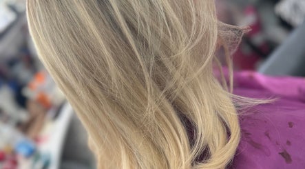 Stylish blonde hair highlighting service at Dynamix Hair Salon, Carluke, Scotland, GB.