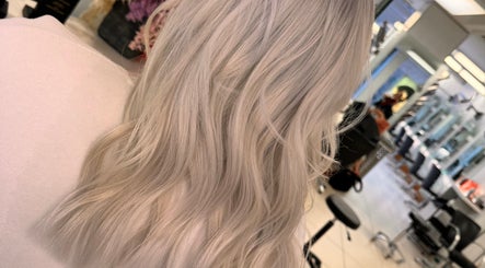 Silky blonde hair waves styled at Dynamix Hair Salon, Carluke, Scotland, GB.