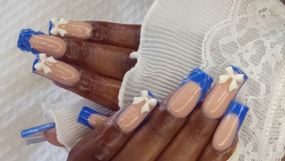 Blue and nude nails with bows at GrapUglow Beauty Academy, Benoni, Gauteng, ZA.