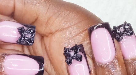Stylish pink nails with black bows at GrapUglow Beauty Academy, Benoni, Gauteng, ZA.