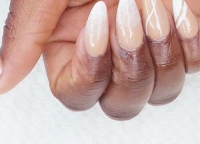 Close-up of elegant nude nails with white design at GrapUglow Beauty Academy, Benoni, Gauteng, ZA.