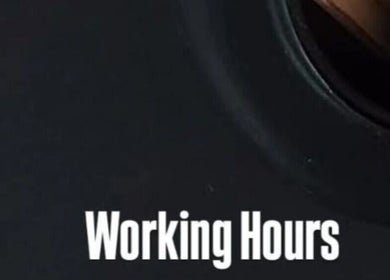 Close-up of clock face indicating working hours at Its Just Vanity, Germiston, Gauteng, ZA.