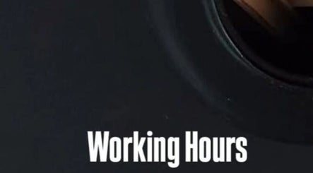 Close-up of clock face indicating working hours at Its Just Vanity, Germiston, Gauteng, ZA.