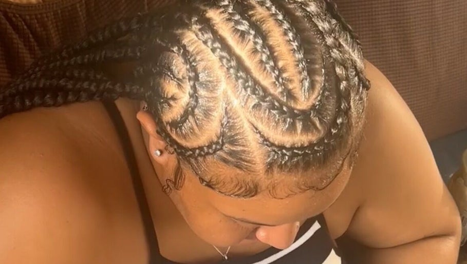 Intricate braided hairstyle at Cr_.hairstyles in Willemstad, Curaçao, CW enhancing natural beauty.