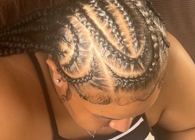 Intricate braided hairstyle at Cr_.hairstyles in Willemstad, Curaçao, CW enhancing natural beauty.