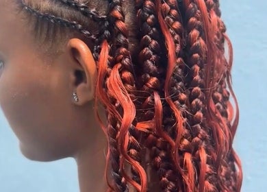Intricate red braids styled at Cr_.hairstyles, Willemstad, Curaçao, CW for a stylish look.
