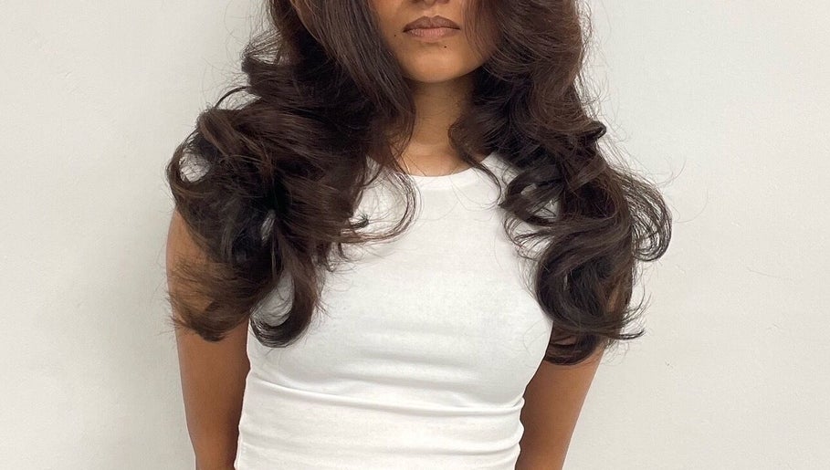 Woman with styled voluminous waves at TAMhair, Milton Keynes, England, GB.