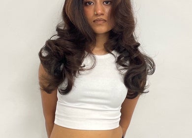 Woman with styled voluminous waves at TAMhair, Milton Keynes, England, GB.