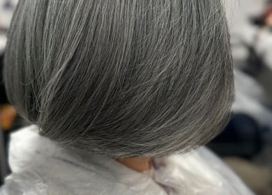 Close-up of a sleek silver bob hairstyle at TAMhair, Milton Keynes, England, GB.