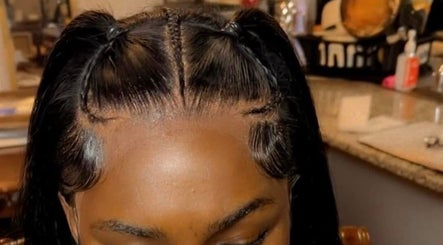 Intricate braided hairstyle by Beautified By Ashiunna in Yazoo City, Mississippi, US.