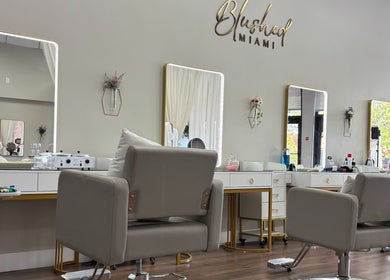 Modern beauty studio at Blushed Miami, Palmetto Bay, FL, US with stylish chairs and mirrors.
